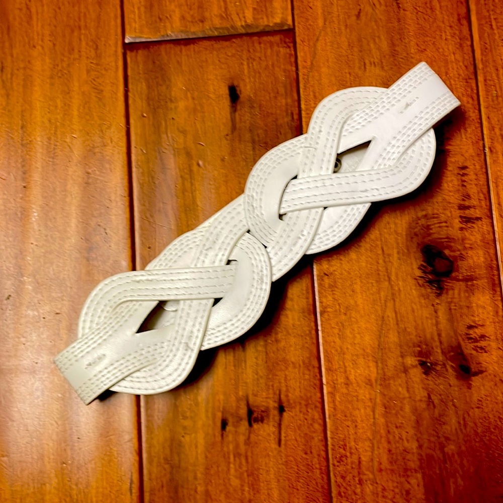 White circular design belt with back closure size Small / Medium